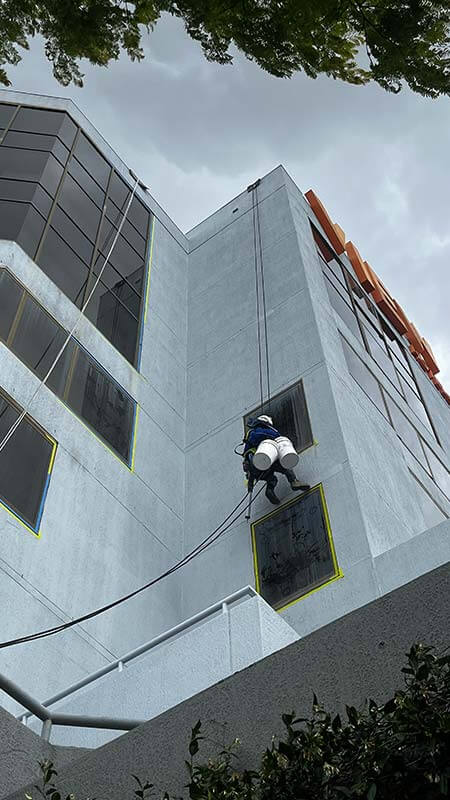 abseiling-with-buckets-for-repair