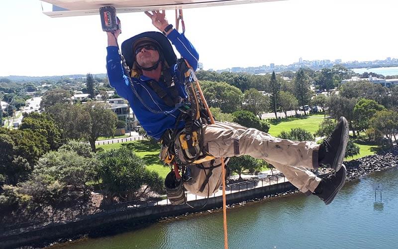 at height concrete repair suspended from harness